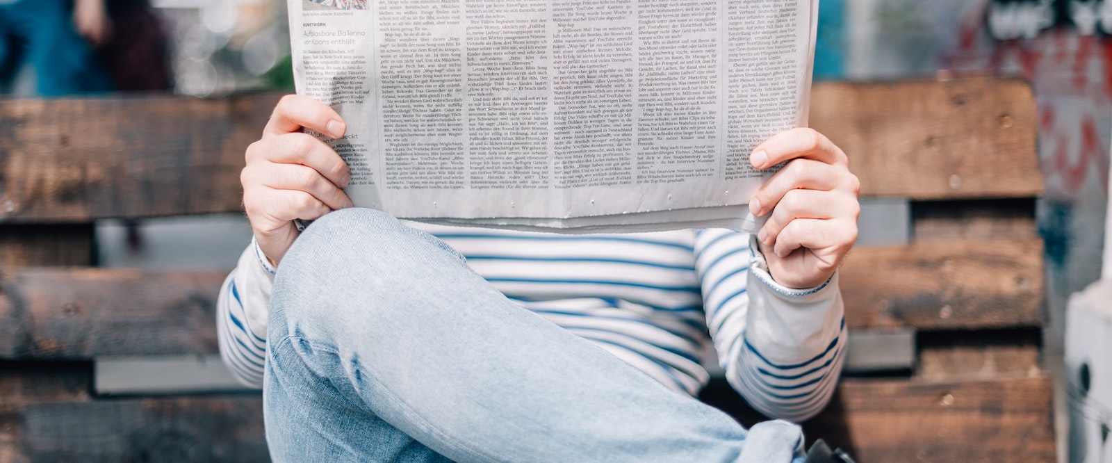 person reading a newspaper